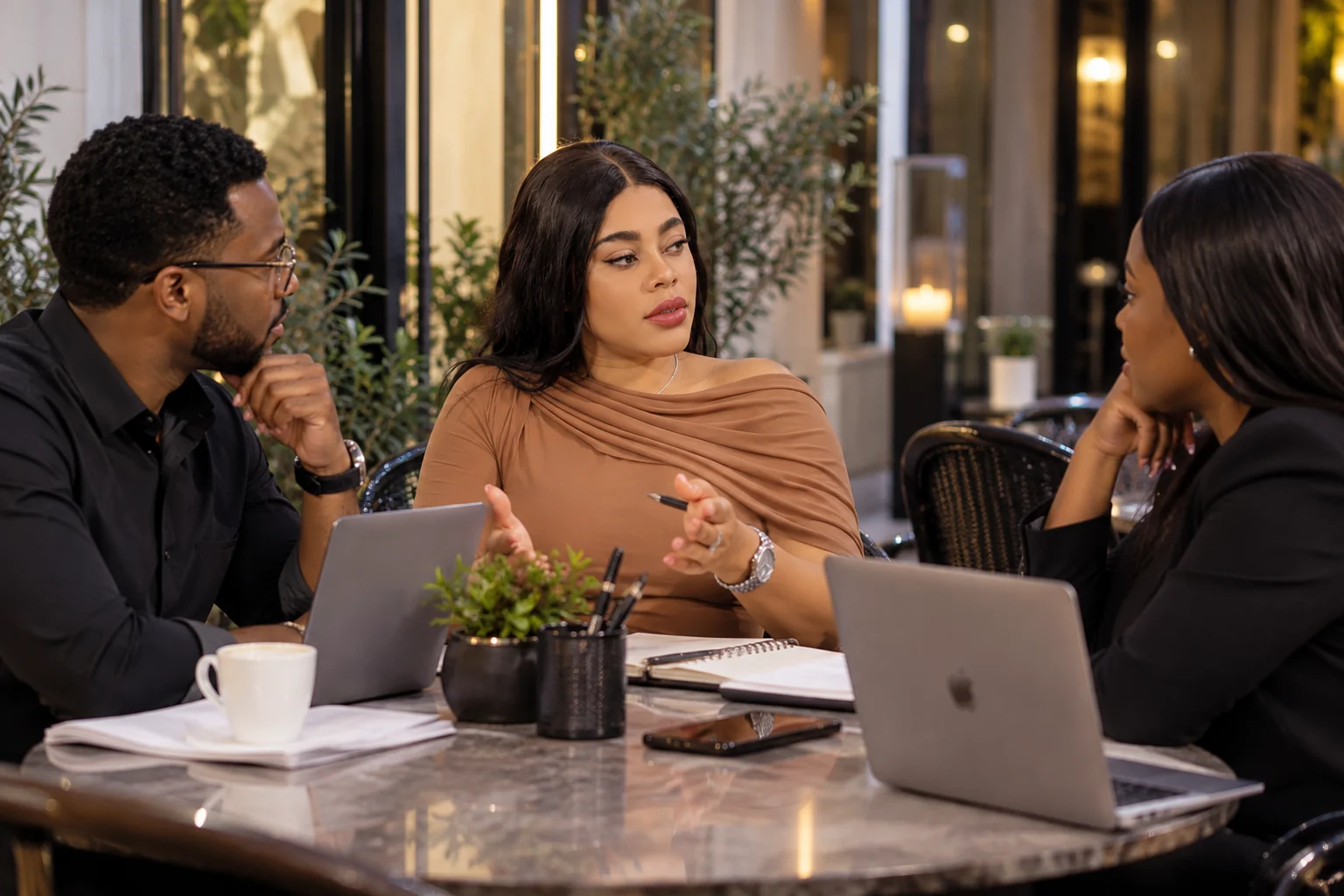 Louisard Lapierre in a conversation with two people around a table